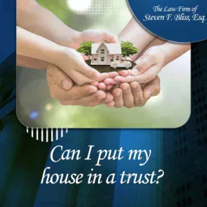 Hands from three people holding a toy house simulating a home placed into a living trust.